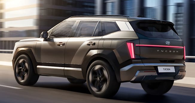 2027 Hyundai Tucson, rear, driving in a city