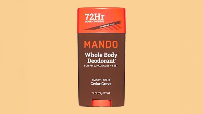 Mando Whole Body Smooth Solid Cedar Grove Deodorant on light orange background