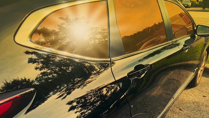 Sunlight shining on back window of parked SUV