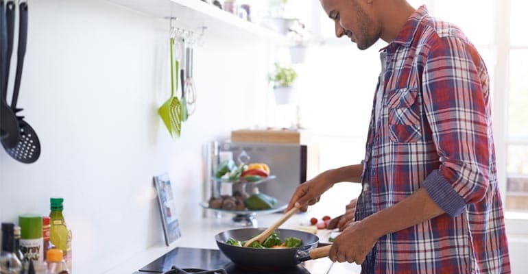 A man cooking something.