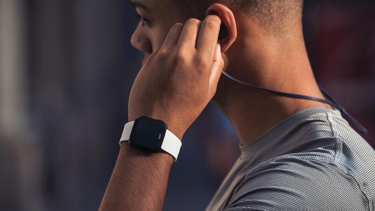 wearing fitbit and apple watch