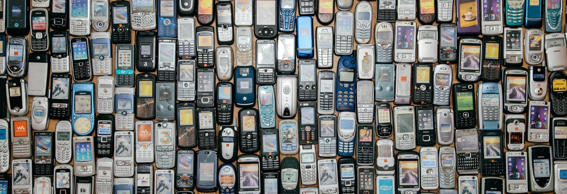 For an article on how to recycle old electronics, this photo shows a pile of old digital gadgets.