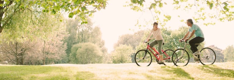 A man and a woman on bicycles.