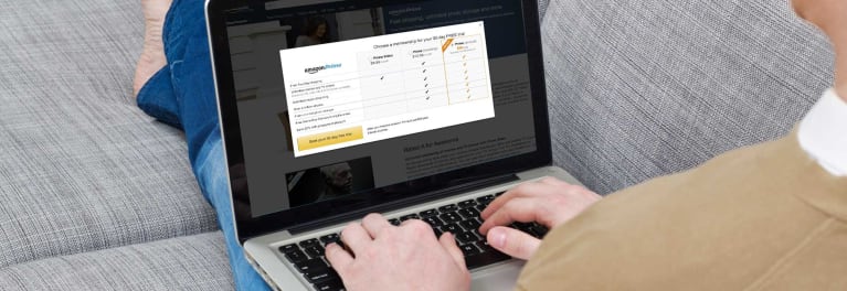 Photo of a person reviewing the Amazon Prime membership plans on a laptop.