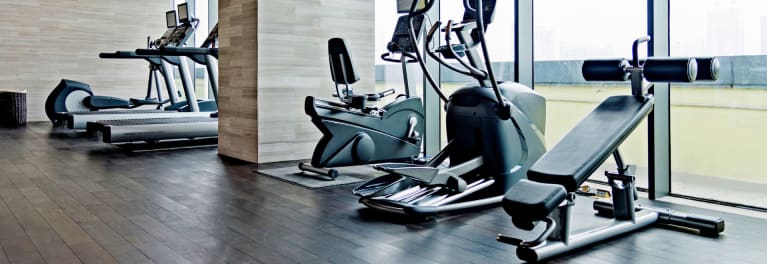 Exercise machines in a commercial gym.