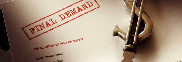 A photo of a bill with a stamped warning of a final demand for payment