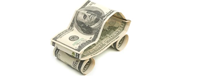 currency (bills) in the shape of a car